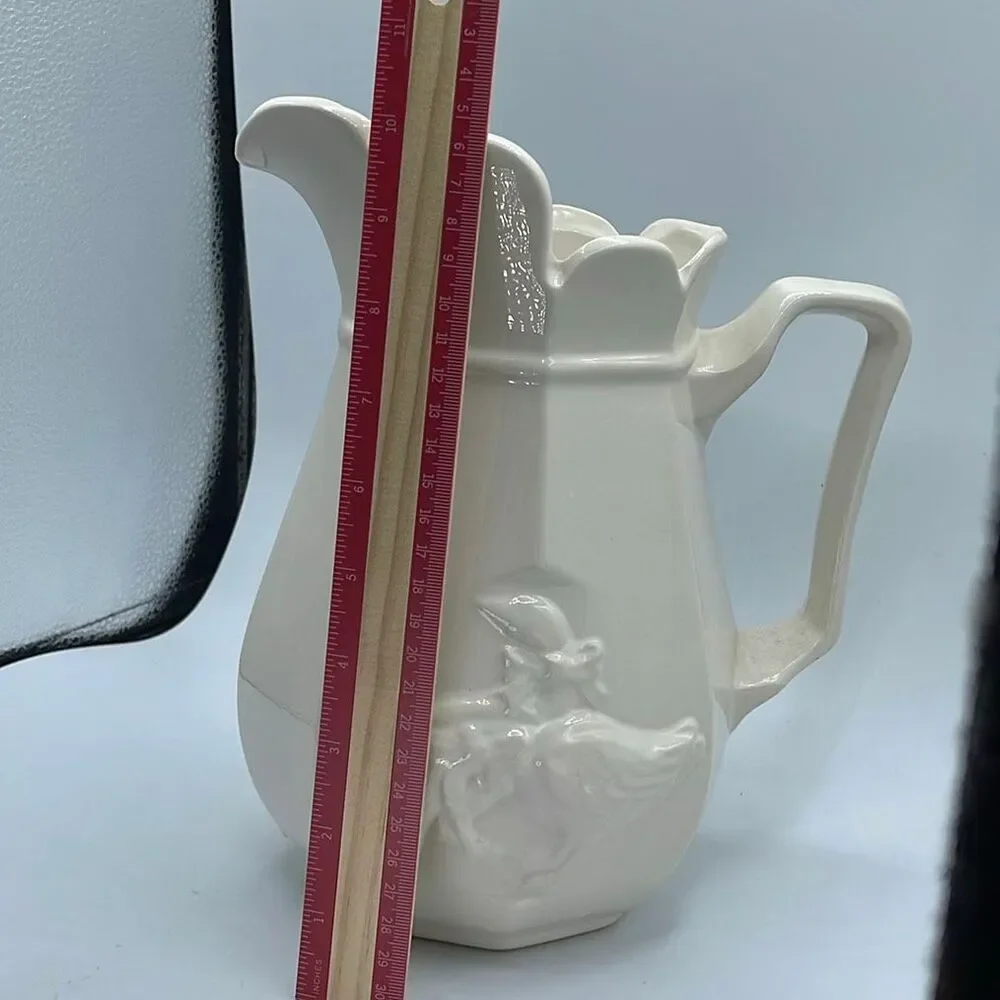 Vintage embossed ceramic country goose pitcher .